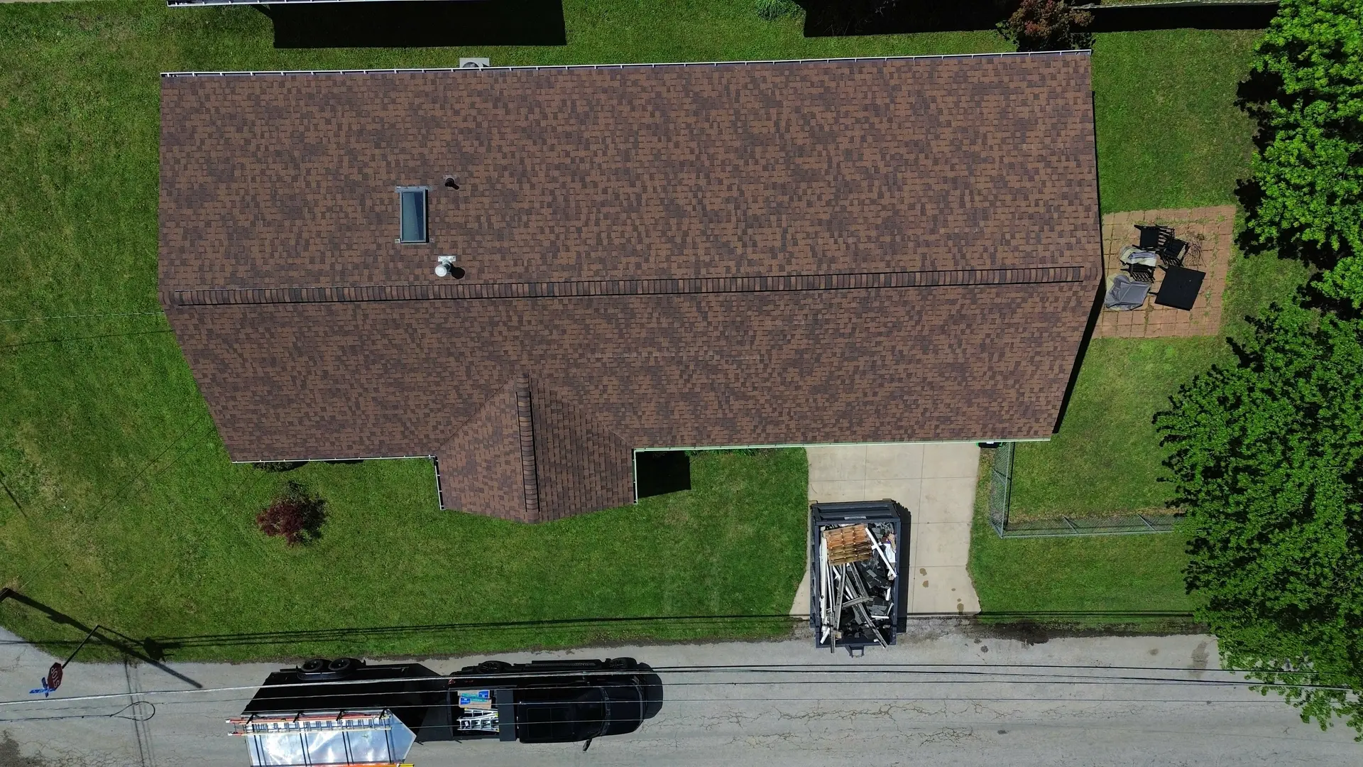 Color-matched seamless gutters on a roofline in Akron, Ohio by Rise Roofing